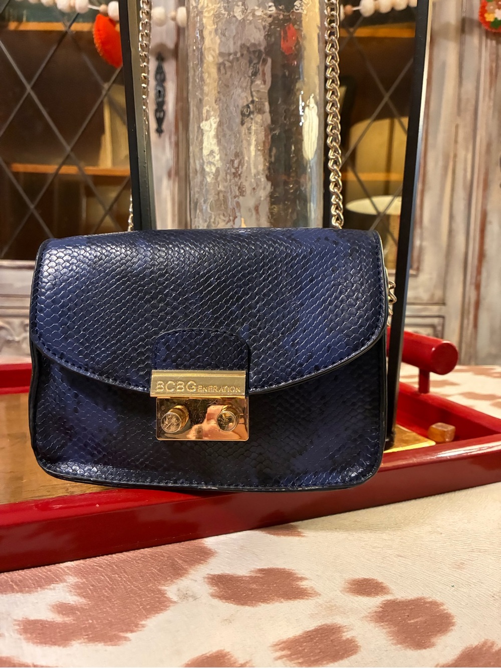 BCBGeneration Navy Snake-Print Crossbody with Gold Hardware